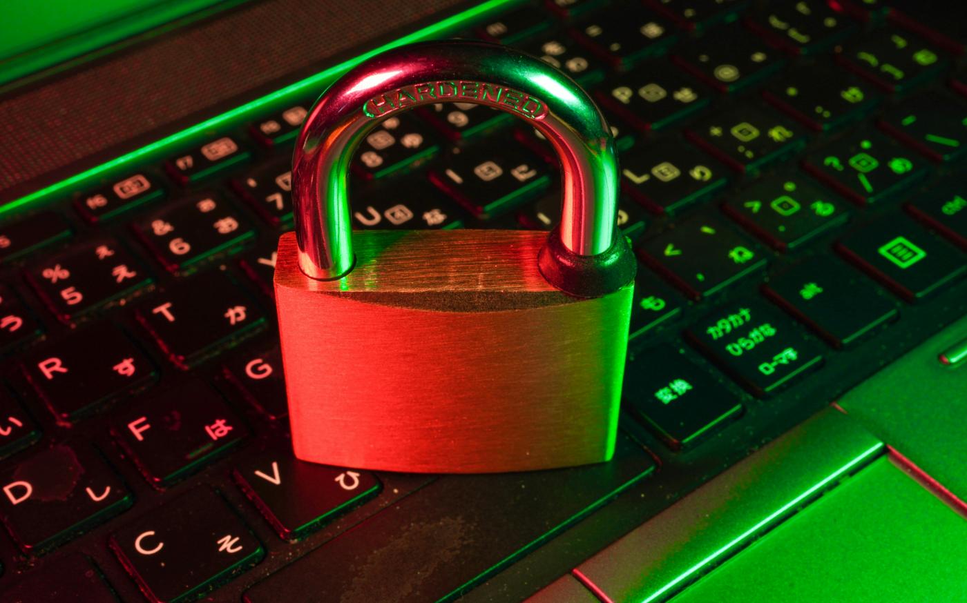 red padlock on black computer keyboard by FlyD courtesy of Unsplash.