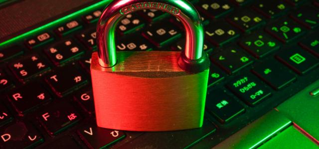 red padlock on black computer keyboard by FlyD courtesy of Unsplash.